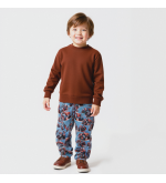 Waterdichte broek voor jongens met tractorprint in het rood.